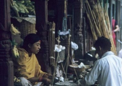 A shopkeeper sells vegetable in the street of Kathmandu in 1975AD Most probably Kathmandu Durbar Square Copyright & Source: Johan Reinhard