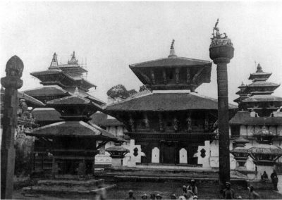 The Jagannath temple (dedicated to Vishnu 1563 AD) in Kathmandu Durbar Square. The pillar on the foreground surmounted by King Pratap Malla