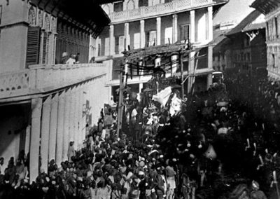 One of the earliest photos of Gaddhi Baithak during Indra jatra taken during 1900s After the earth quake, much part of the palace was lost and Juddha Sadak or New road took its place. Gaddi Baithak on the left side of the picture is still the old structure built by Bhimsen Thapa Photo Source: Juju Tuladhar This form of the palace has also been painted by which can be viewed at https://www.facebook.com/photo.php?fbid=251449514894292&set=a